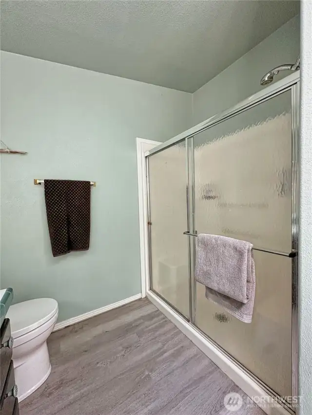 Large walk-in shower with built in seating