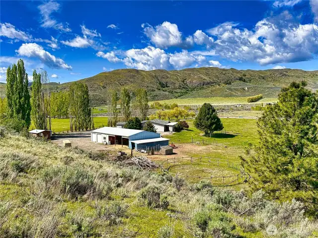 99' Fleetwood with 2,080sf, 2-car attached garage, multiple outbuildings on 7.41 acres