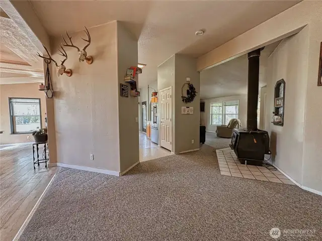 View of open office space to dining, kitchen, living room