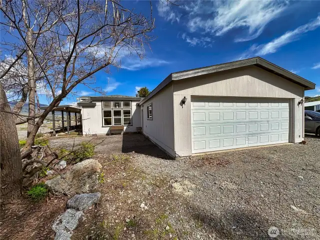 528sf 2-car attached garage and front concrete patio area