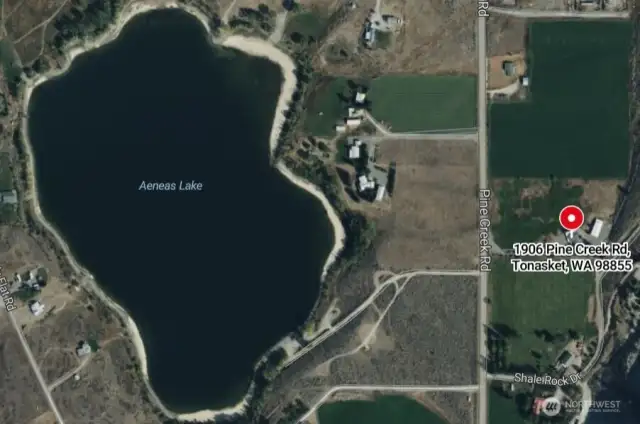 Aerial view of property and Aeneas Lake