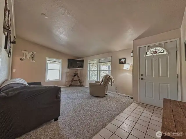 Living room and main entrance with ceramic tile entry