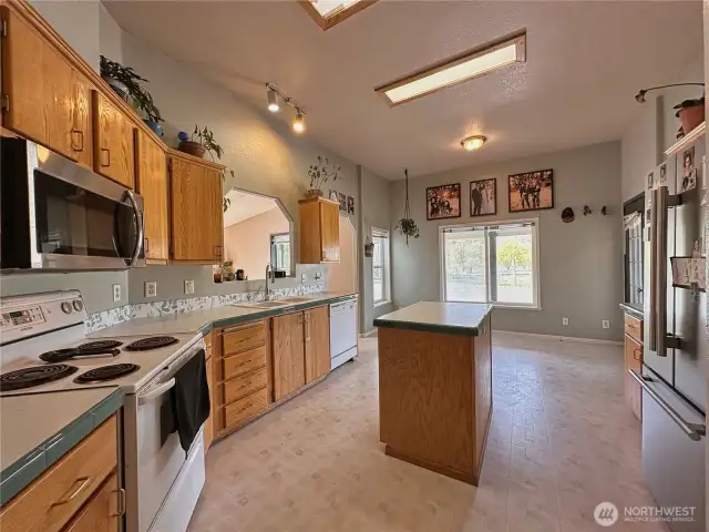 Kitchen includes walk-in pantry and the appliances convey with home sale