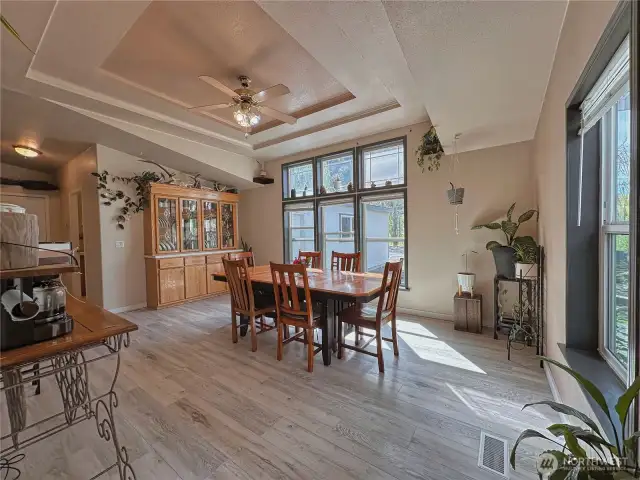 Large room with tray ceiling design currently used as dining space or the perfect location for a 2nd living room/family room