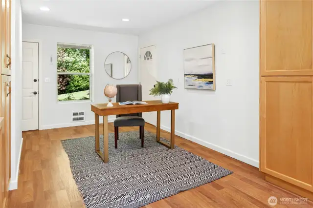 Just off the kitchen is the office/den with walls of built-in cabinetry space. From this room you can easily get to the backyard, garage and front yard.