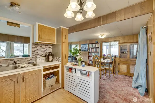 Kitchen with view of living and dining