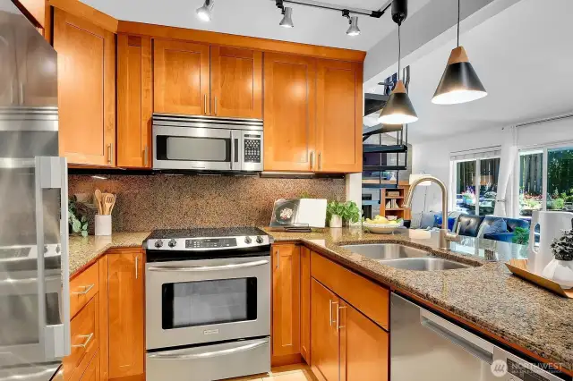 With updated appliances and light fixtures, the highly efficient kitchen functions as the heart of the living space