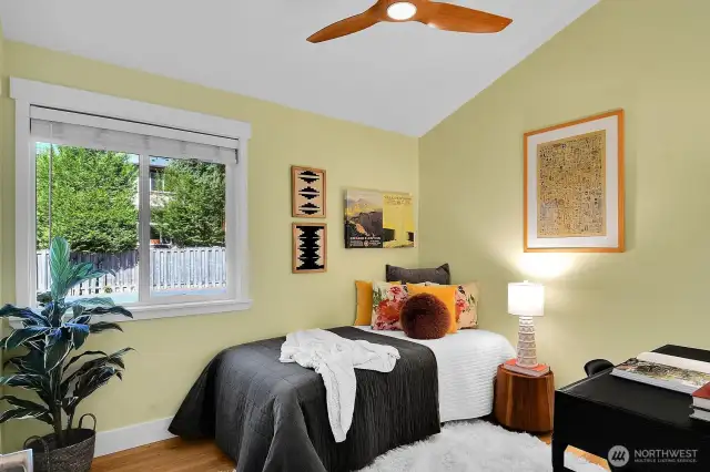 The second bedroom has the same vaulted ceiling and fan