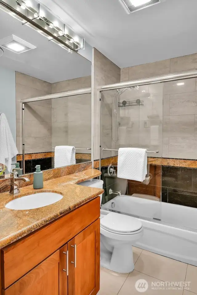 Second bathroom has a tub and a shower
