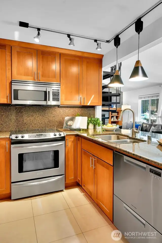 Lots of storage in the kitchen, and fresh tile floors