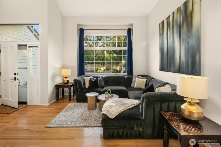 Vaulted ceilings make the entry way and living room bright and airy! Natural oak hardwood floors throughout the main level of this gorgeous home.
