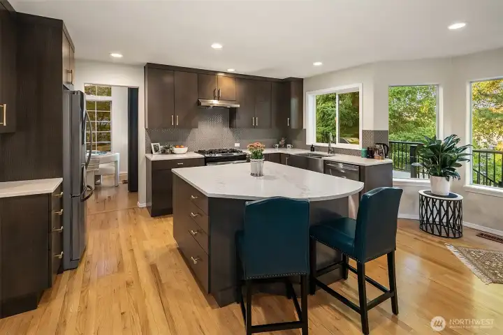 Kitchen totally remodeled in 2015. Custom quarter sawn white oak cabinets, pullouts, soft close, tray racks and large pot drawers. New can lighting and stainless farmhouse sink. Beautiful details.