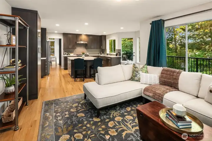 Spacious family room off the kitchen is a great place to enjoy with more large windows and green views!