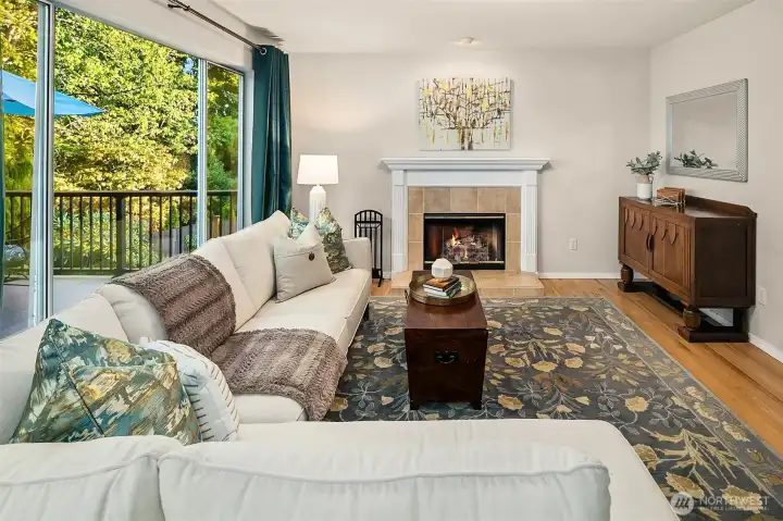 Wood burning fireplace for those cozy winter evenings! Family room and kitchen both overlook the expansive new deck replaced in 2021.