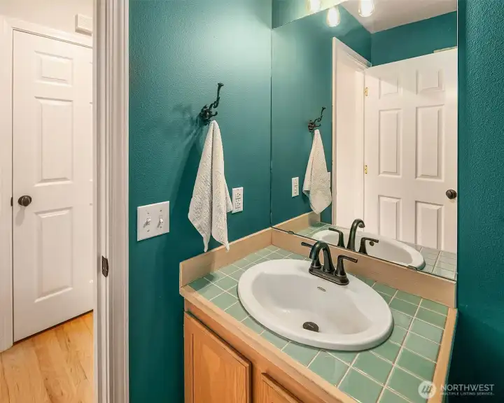 Main floor powder room conveniently located.