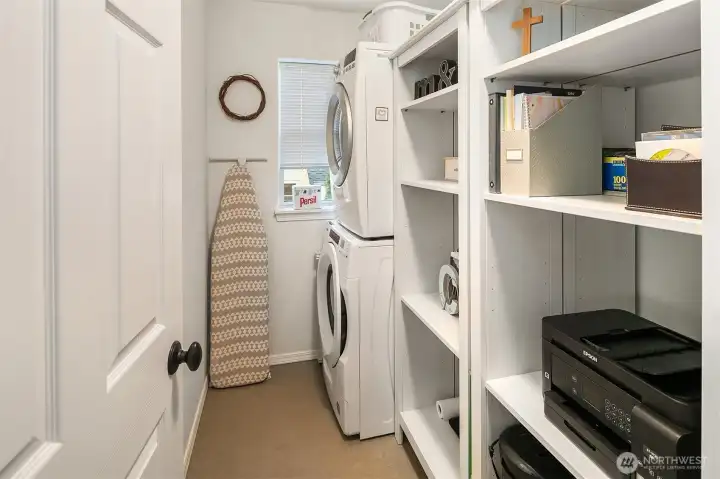 Off the family room and on the way to the garage is this great utility room for laundry, mud room and extra storage. All appliances included!