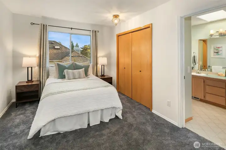 Bedroom number 2 upstairs is comfortable with a double closet and custom lighting. Jack and Jill bathroom between bedrooms 2 and 3.