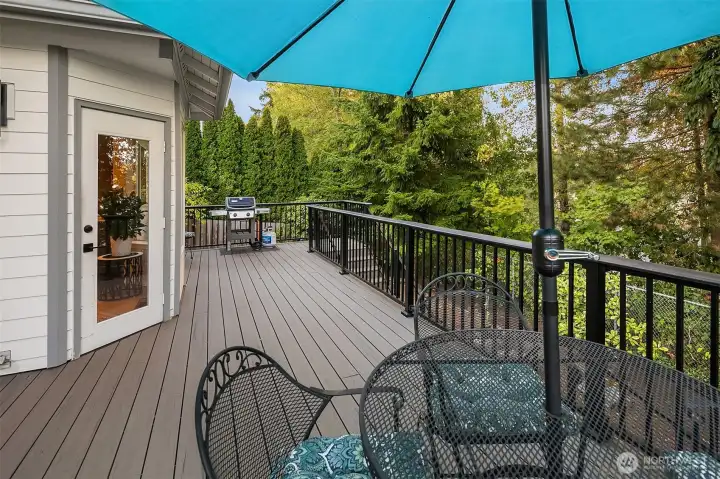 The backyard is set in woodland landscaping design for easy care and a natural setting. Down the stairs you will find a dedicated fire pit for year round enjoyment!