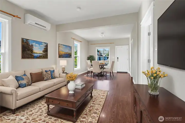 Virtually staged to showcase how this open living/dining space shines with comfort and style.