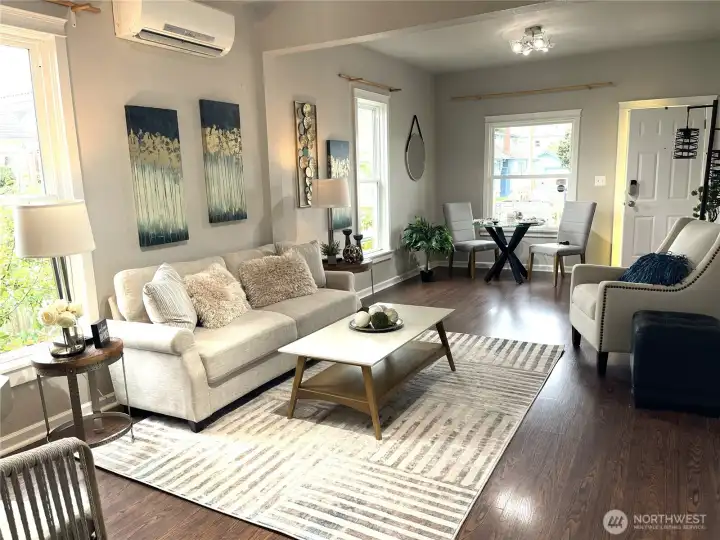 Beautiful open concept living & dining showcases how this home LIVES LARGE with comfort and style.