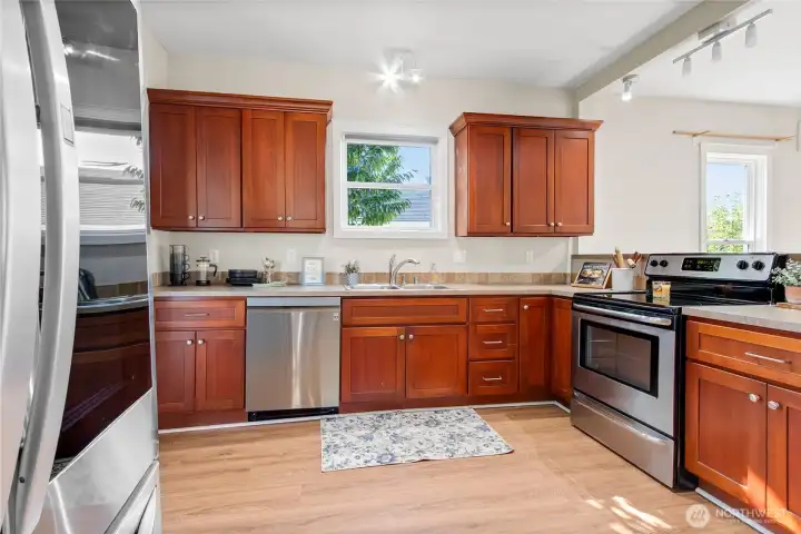 Well-designed kitchen with generous counter space and soft-close cabinetry—style and function in one.