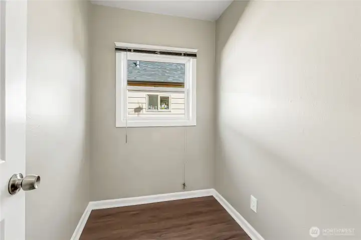 Bright pantry with its own window—ample storage now, endless possibilities for your vision.