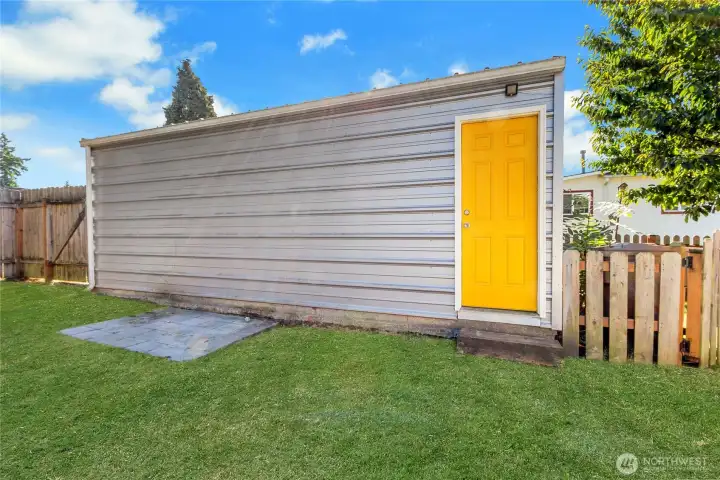 Exterior garage with access from back yard.