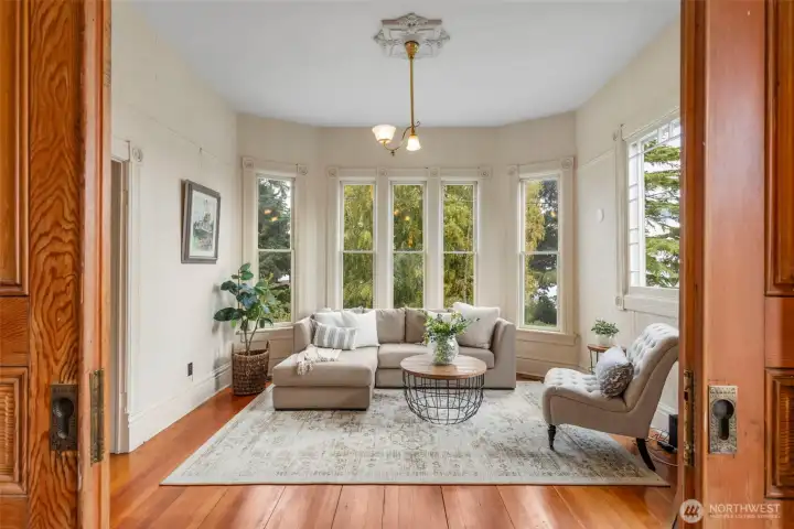 Gorgeous pocket doors lead to formal dining room.