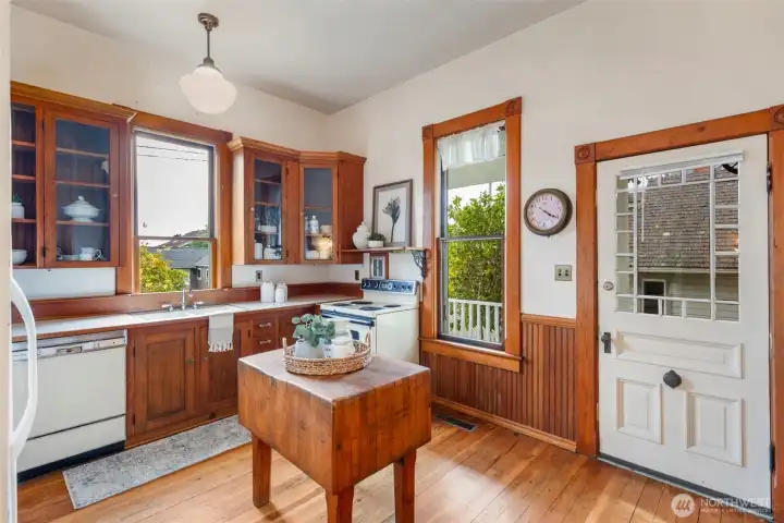 Spacious Craftsman Kitchen leads to charming back porch.