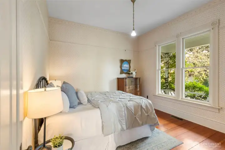 2nd Bedroom overlooking welcoming wraparound porch.