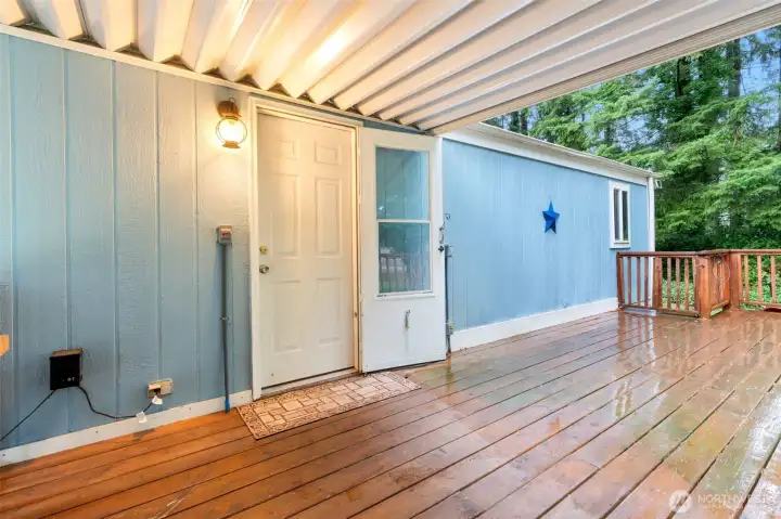 Covered carport and partially covered deck.