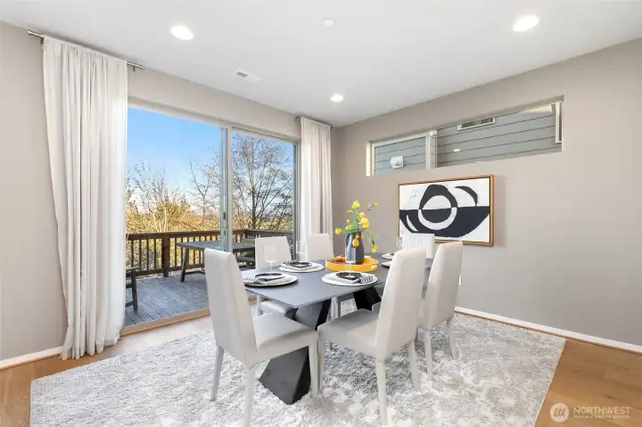 Designated dining area conveniently opens to deck.