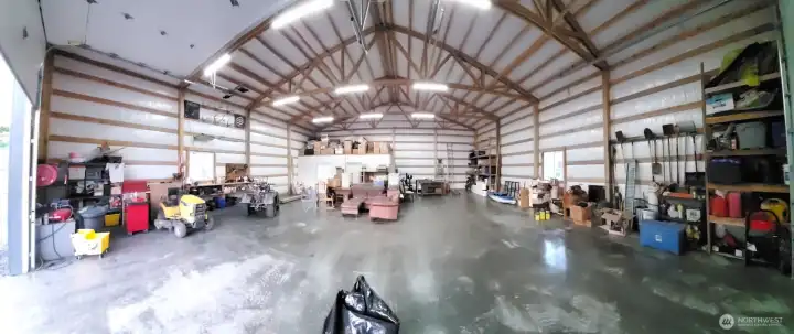 Early wide lens view of shop. Additional storage shelves have been added to the north (left) wall. Picture taken prior to additional belongings being added.