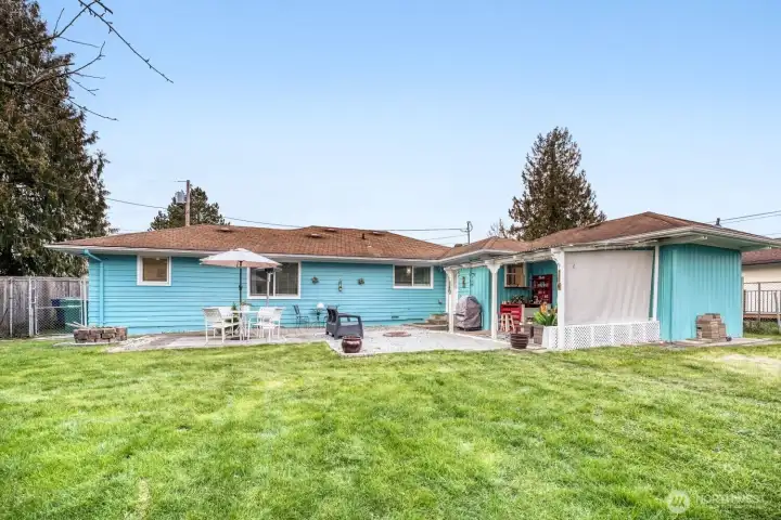 Large fully fenced backyard offering privacy and space to play, garden, or entertain.