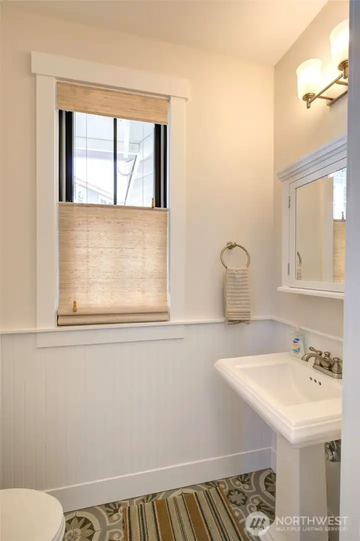 Off the entry is a powder bath for guests.