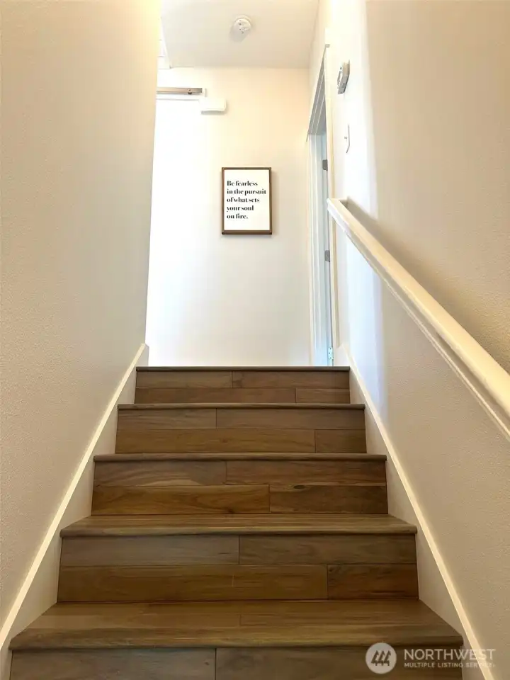 Down the wood stairs leads you to the lower garden level.