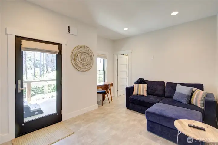You have access to the hot tub and beach paths from this patio door off the family room.  Have to work a bit?  There is a desk for that!