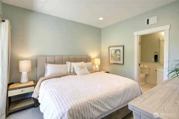 The second primary bath with king bed has patio access as well as a large bathroom and walk in closet.