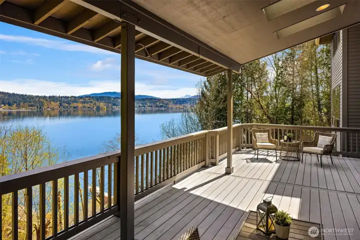 Huge partially covered entertaining deck off the main level, with sliding doors from the kitchen. Mt Rainier is visible on clear days