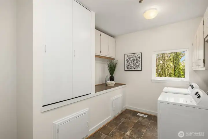 Huge laundry room on the main level, with access to the two car garage. A lot of deep cabinets for convenient storage