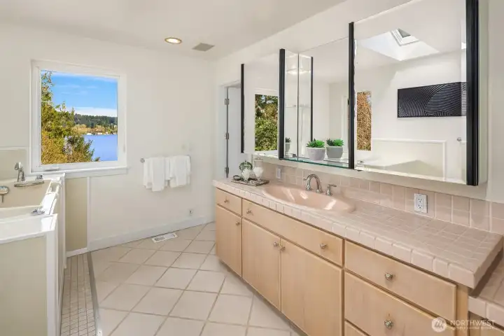 The Ensuite bathroom for the second primary suite on the upper floor. Plenty of space for dual vanities. Not shown is a walk-in shower and walk-in closet