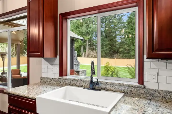 Large Farm Sink with view of backyard.