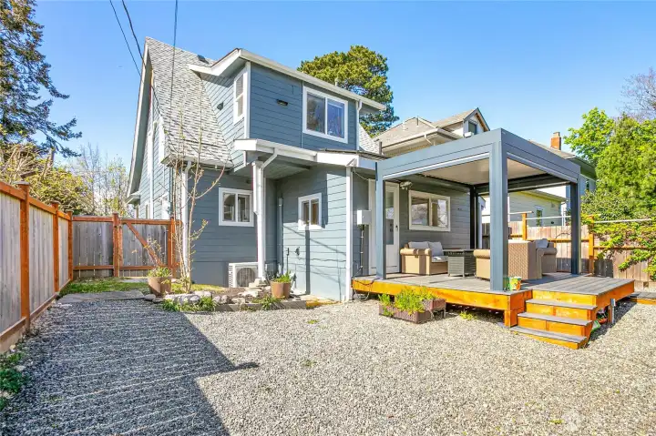 Custom pergola with motorized privacy shades. New exterior fencing.