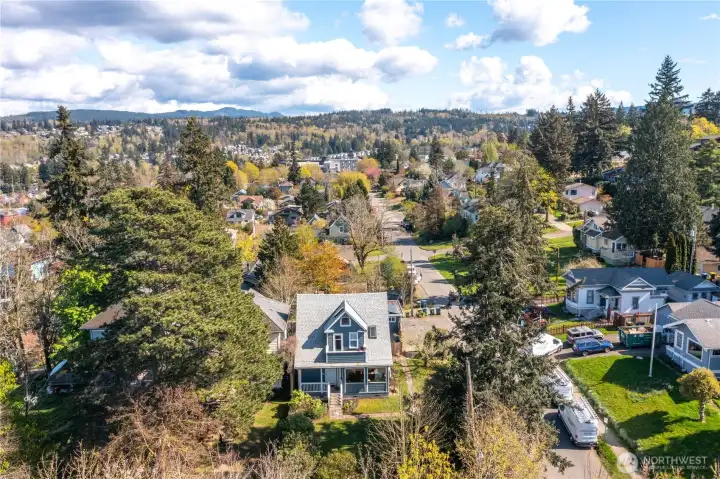 Corner lot duplex with architectural details exudes character and usable space.