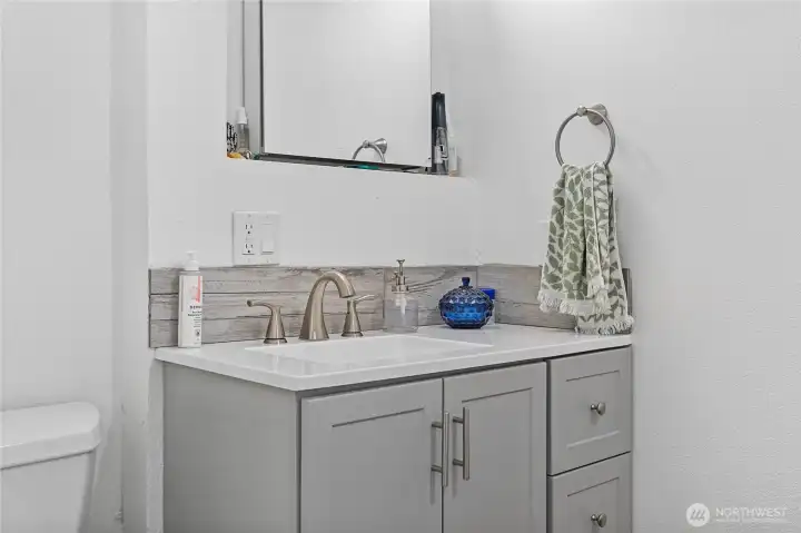 Designer bathroom remodels on the main floor.