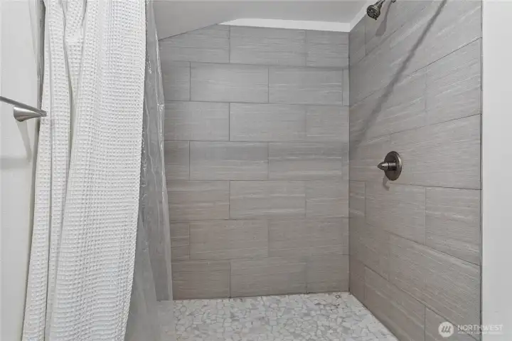 Tiled shower surround.