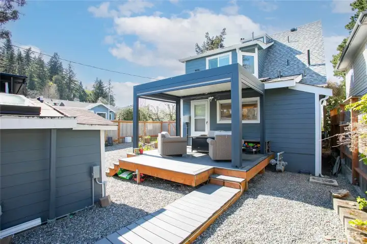 Fresh landscaping and a deck on the main floor unit.