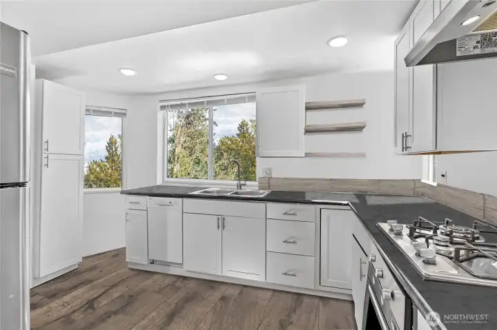 Another angle of the upstairs unit, notice high-end appliances and thoughtfully designed kitchen.