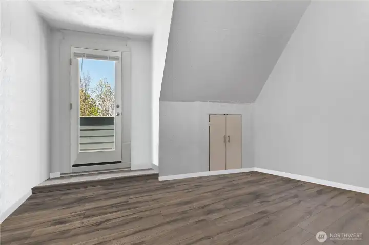 One of two upstairs bedrooms with a view deck.