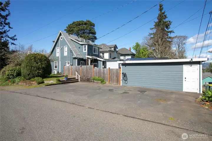 EV car charging off the side of the detached studio.